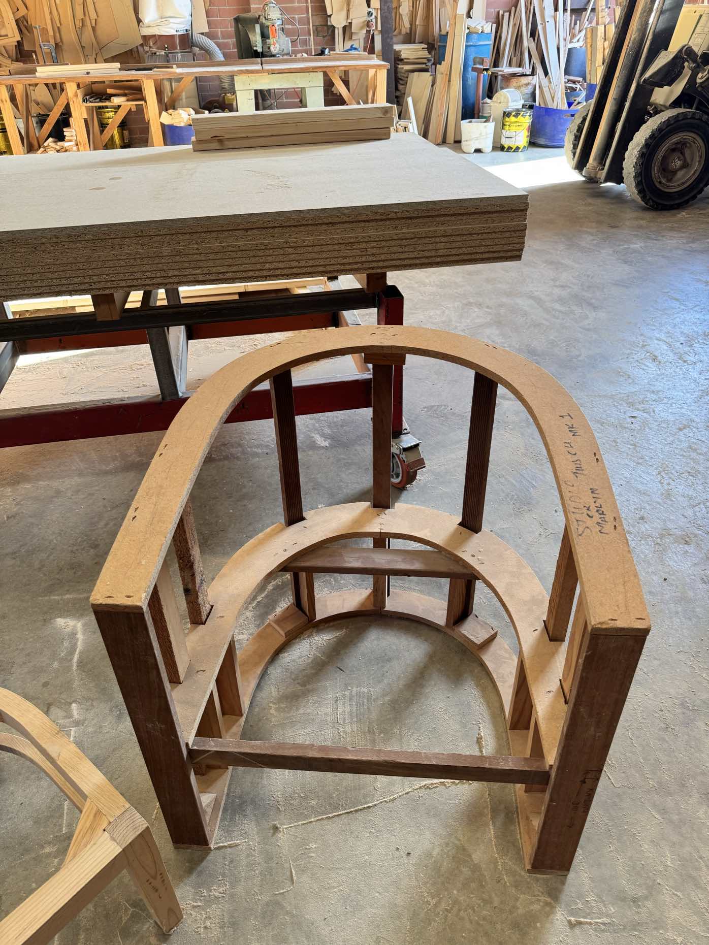 Chair frame with arched back design