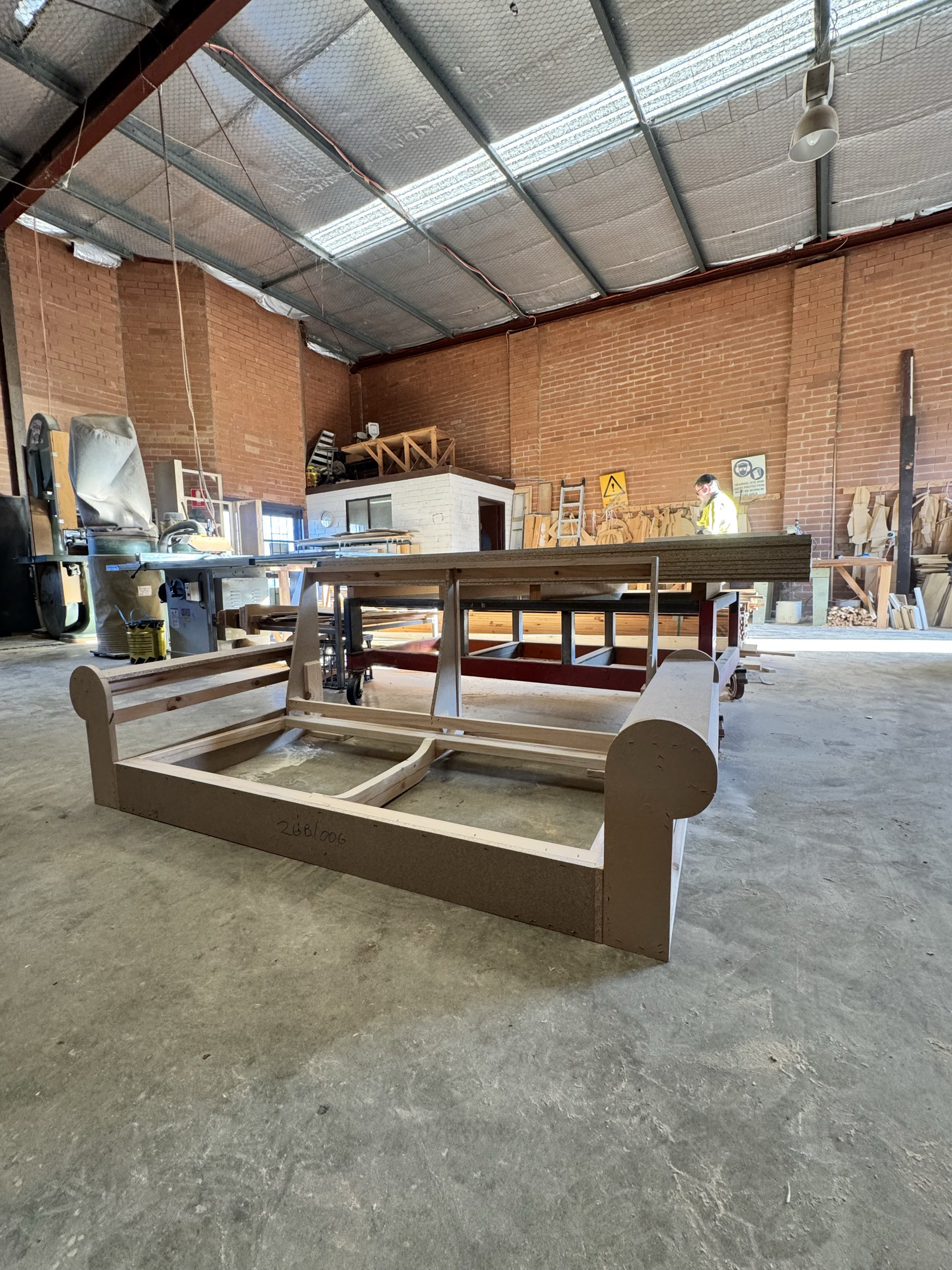 Sofa frame with rolled bolster arms
